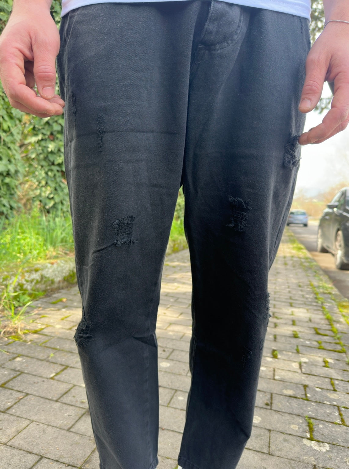 Jeans nero strappato