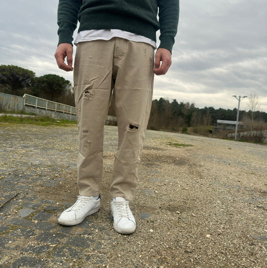 Jeans beige strappato