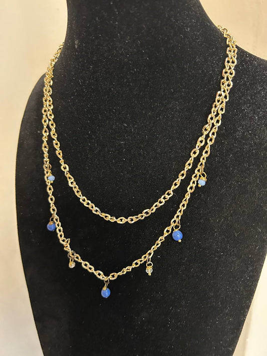 Collana doppia catena in color oro con cristalli azzurri e pietre blu chiaro